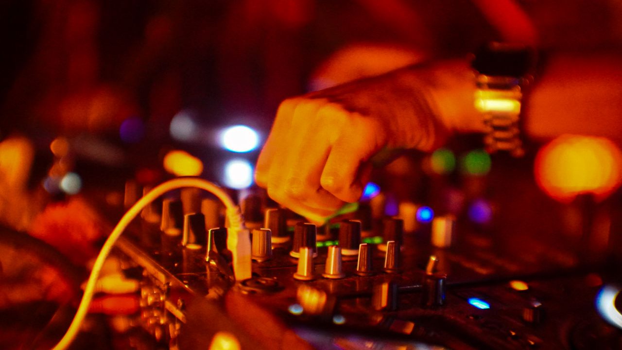 Mastering the First Impression: Your intriguing post title goes here Vibrant DJ performance capturing the essence of night parties in Mexico City with dynamic lighting and music equipment.